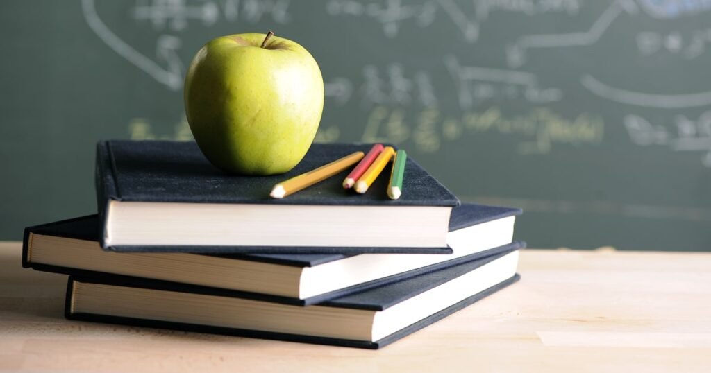 250428-apple-on-desk-school-classroom-stock-ac-436p-9ac2fa.jpg