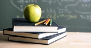250428-apple-on-desk-school-classroom-stock-ac-436p-9ac2fa.jpg
